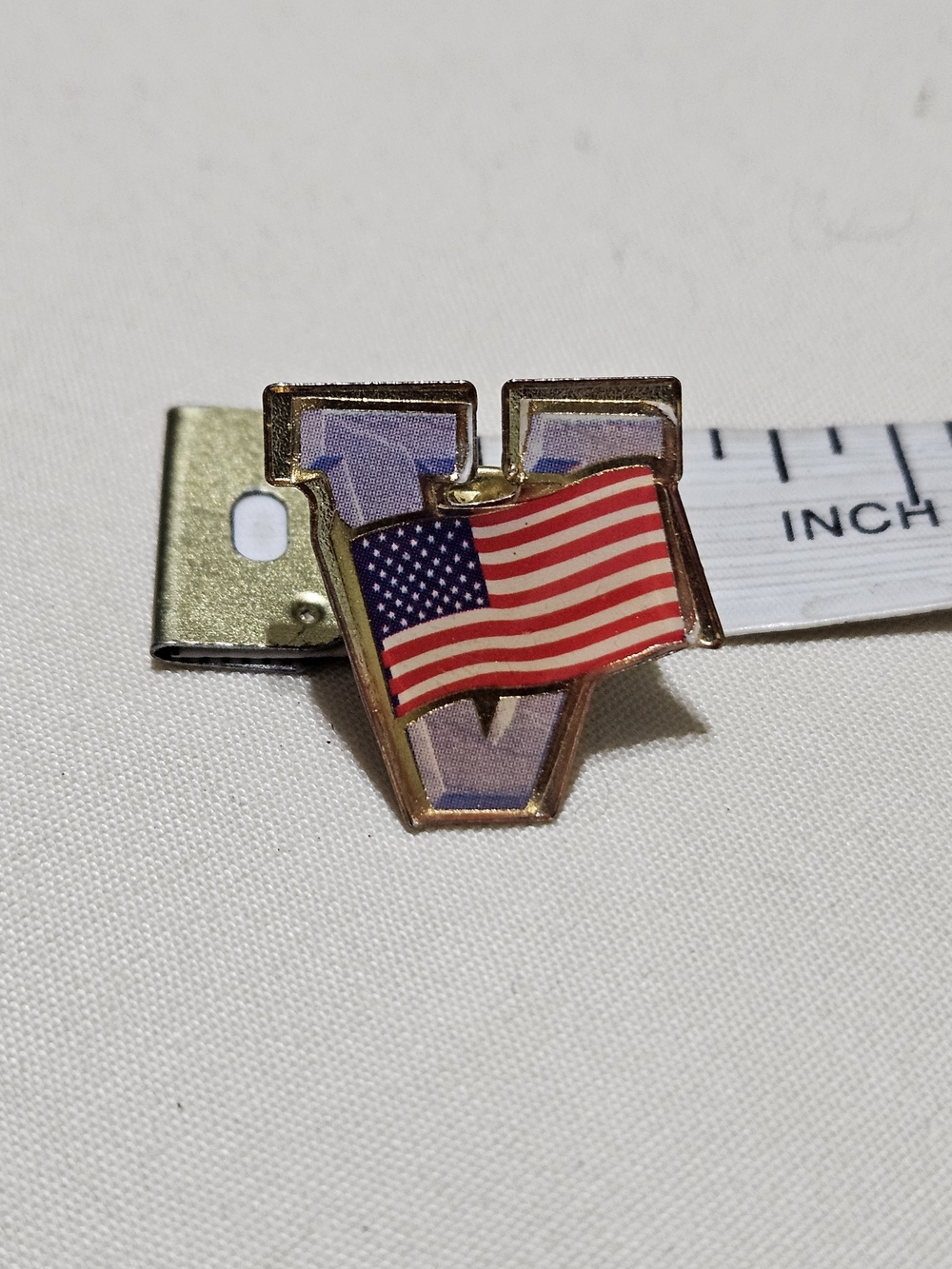 Vintage Gold-tone "V for Victory" lapel pin featuring an American Flag